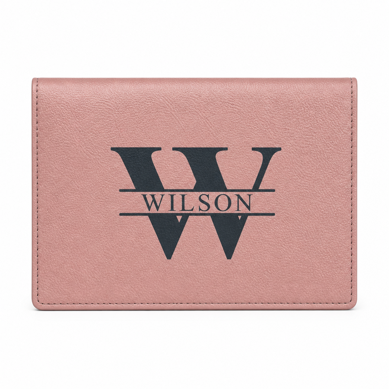 Pink leather wallet with 'Wilson' monogram on a white background