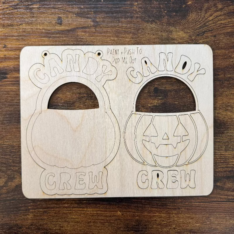 Pop out craft kit with a pumpkin and words saying "Candy Crew"