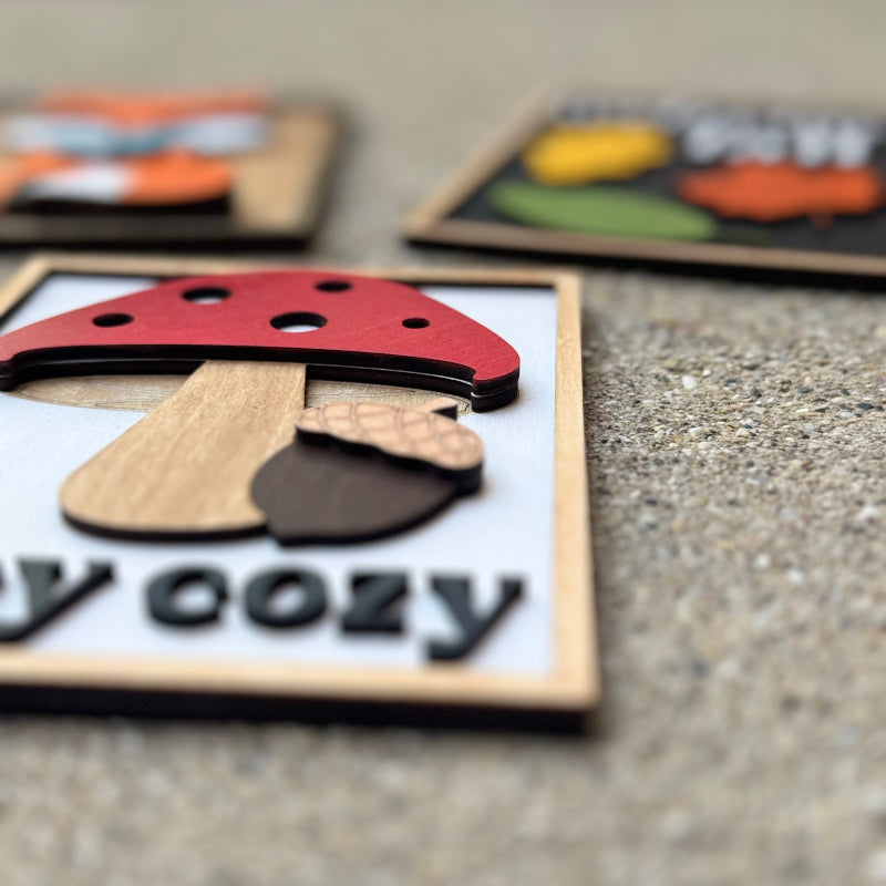 Wooden puzzle with mushroom design on a concrete surface