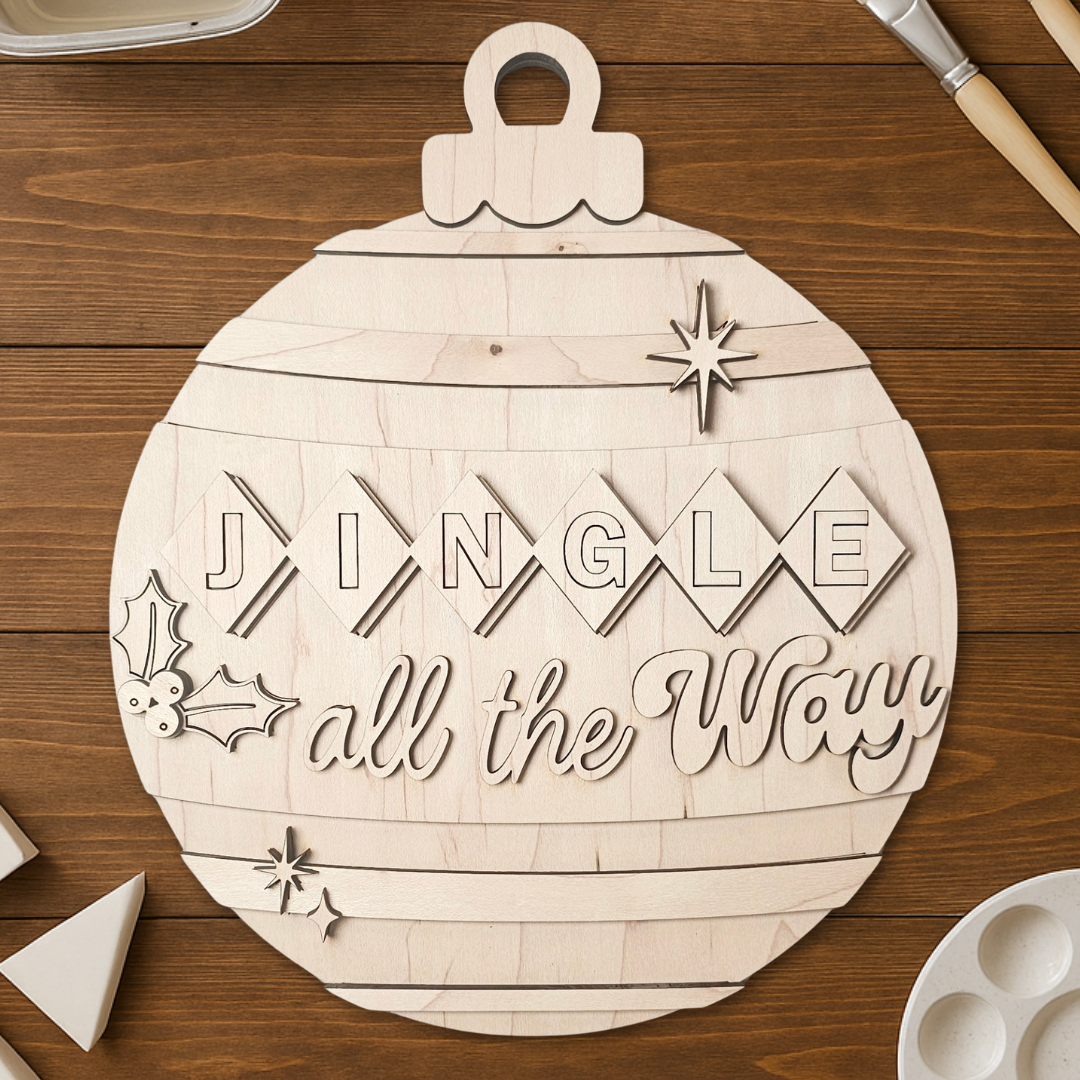 Wooden ornament with 'Jingle all the Way' text on a wooden surface