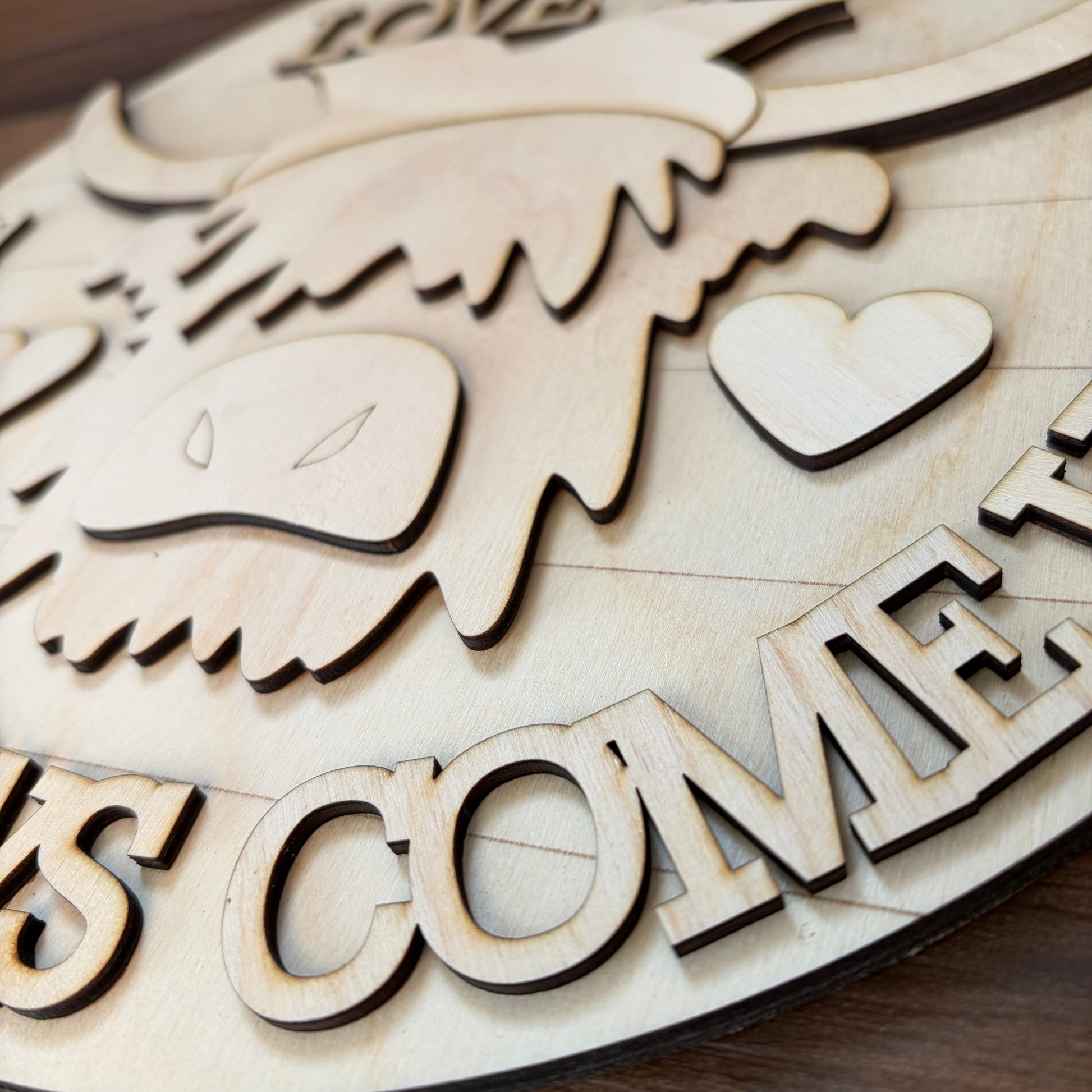 Close up image of a 3D wood DIY kit featuring a highland cow.