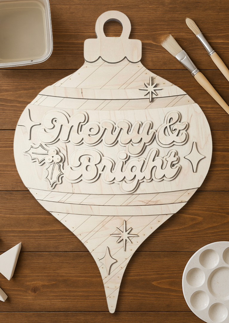 Wooden ornament-shaped door hanger with 'Merry & Bright' text on a wooden surface.