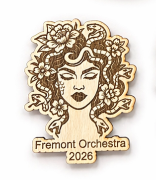 Wooden magnet with floral design and 'Fremont Orchestra 2026' text on a white background