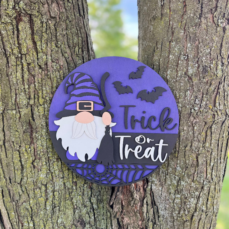 Purple wooden trick or treat sign with a gnome holding a broom